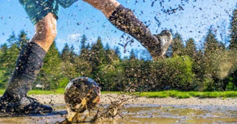 kid-playing-soccer-in-mud