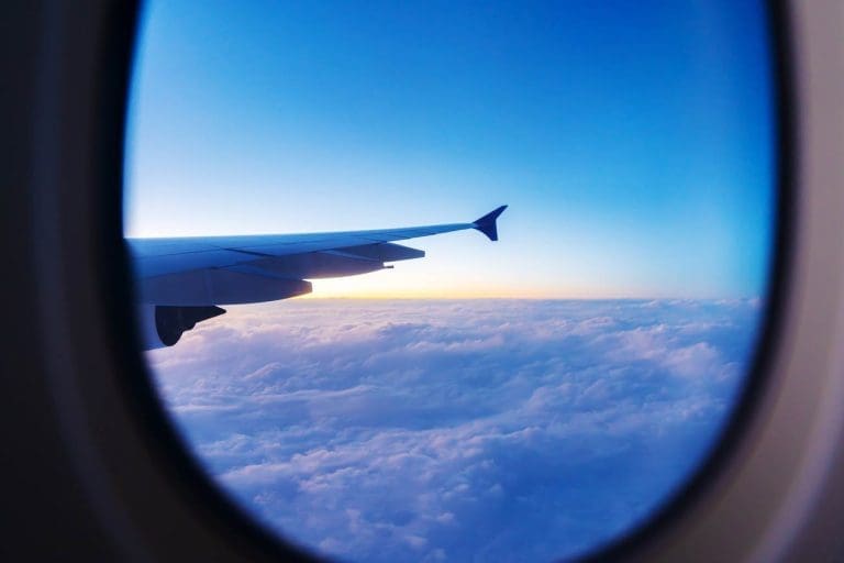 View of sunset out of plane window.