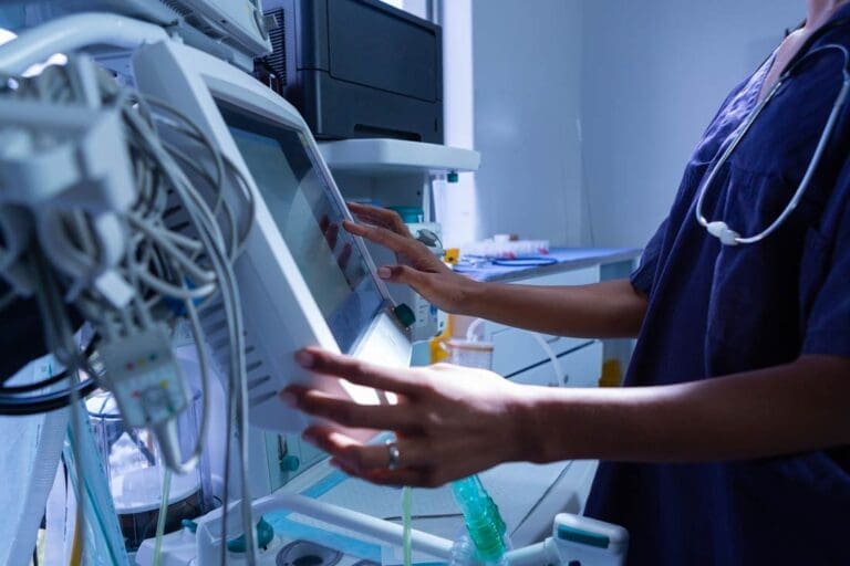 Surgeon using medical equipment in operating room of the hospital