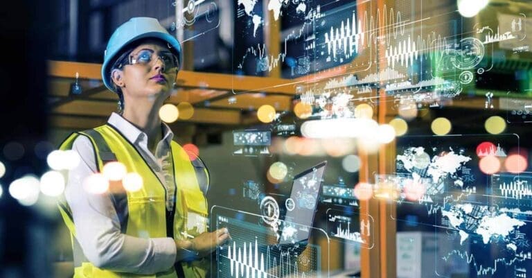 Woman working in manufacturing, industrial factory, holding laptop and viewing 3D data