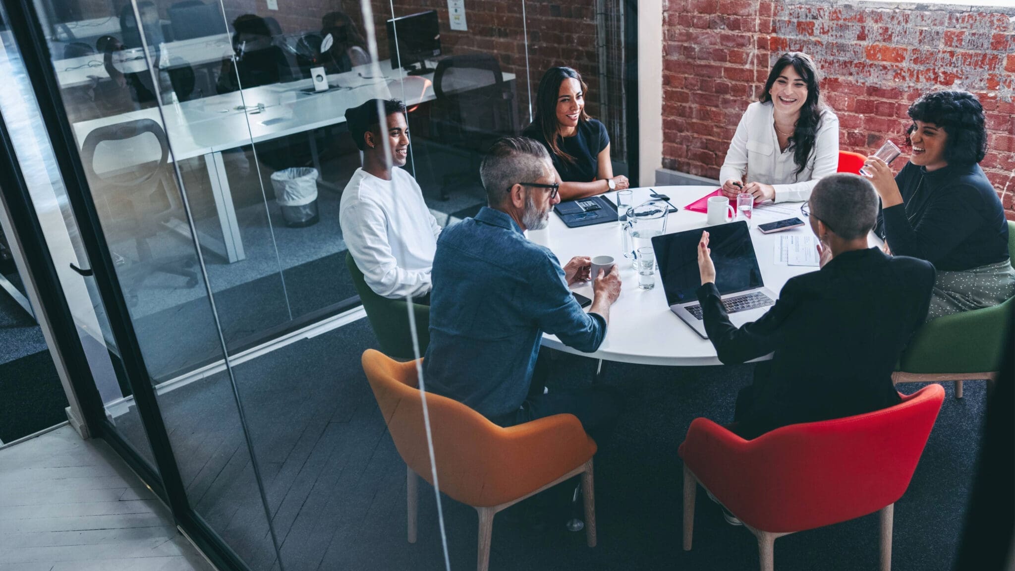 Consulting team roundtable meeting in modern office space